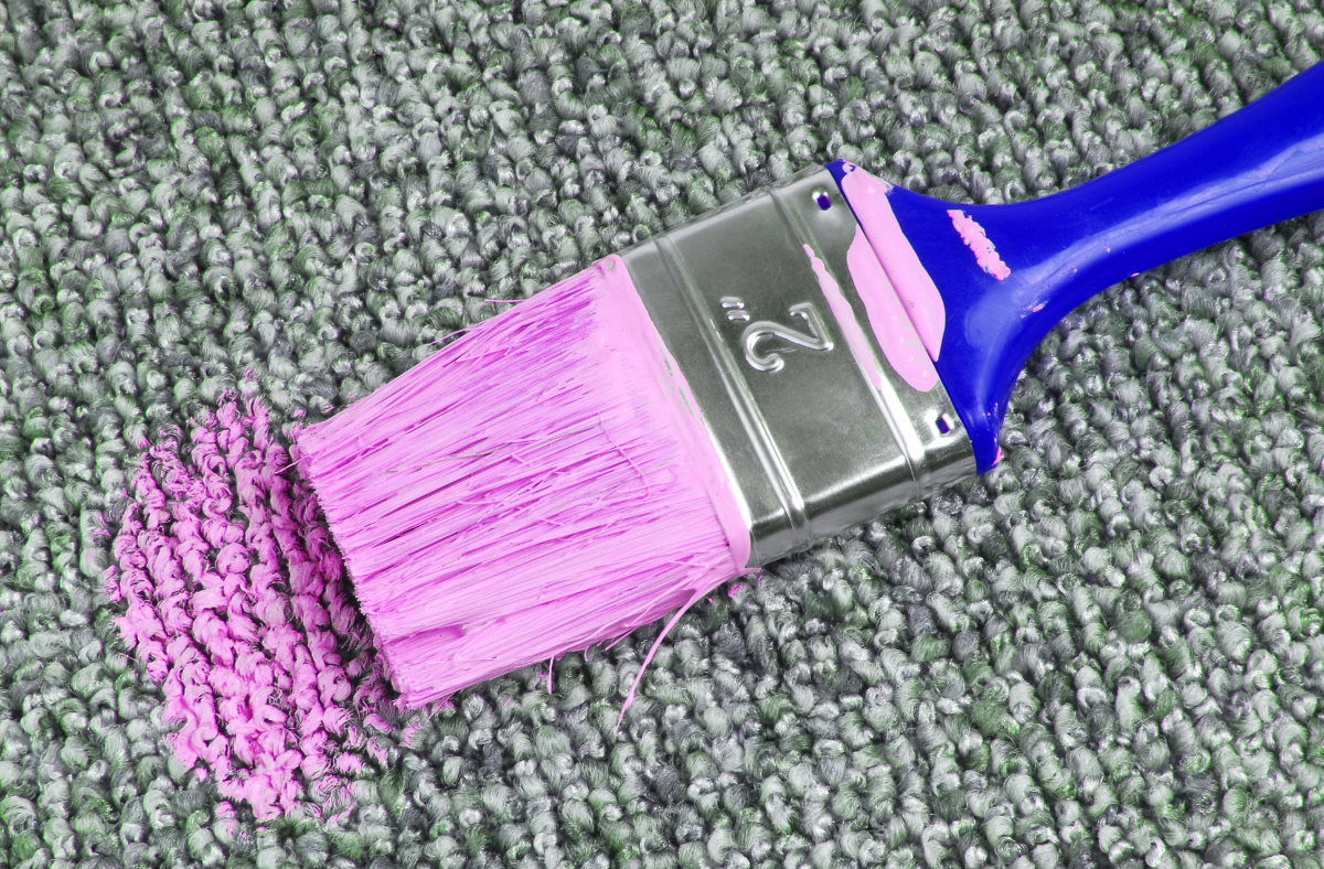 purple paint spilled on carpet