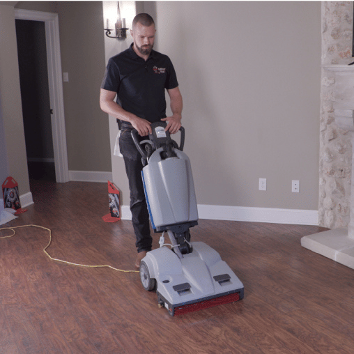 Man Vacuuming Hardwood Floor