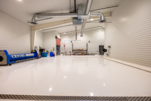 Spacious industrial workshop with white epoxy floor
