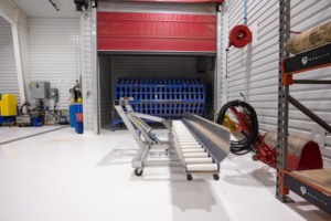 Industrial conveyor system inside warehouse facility